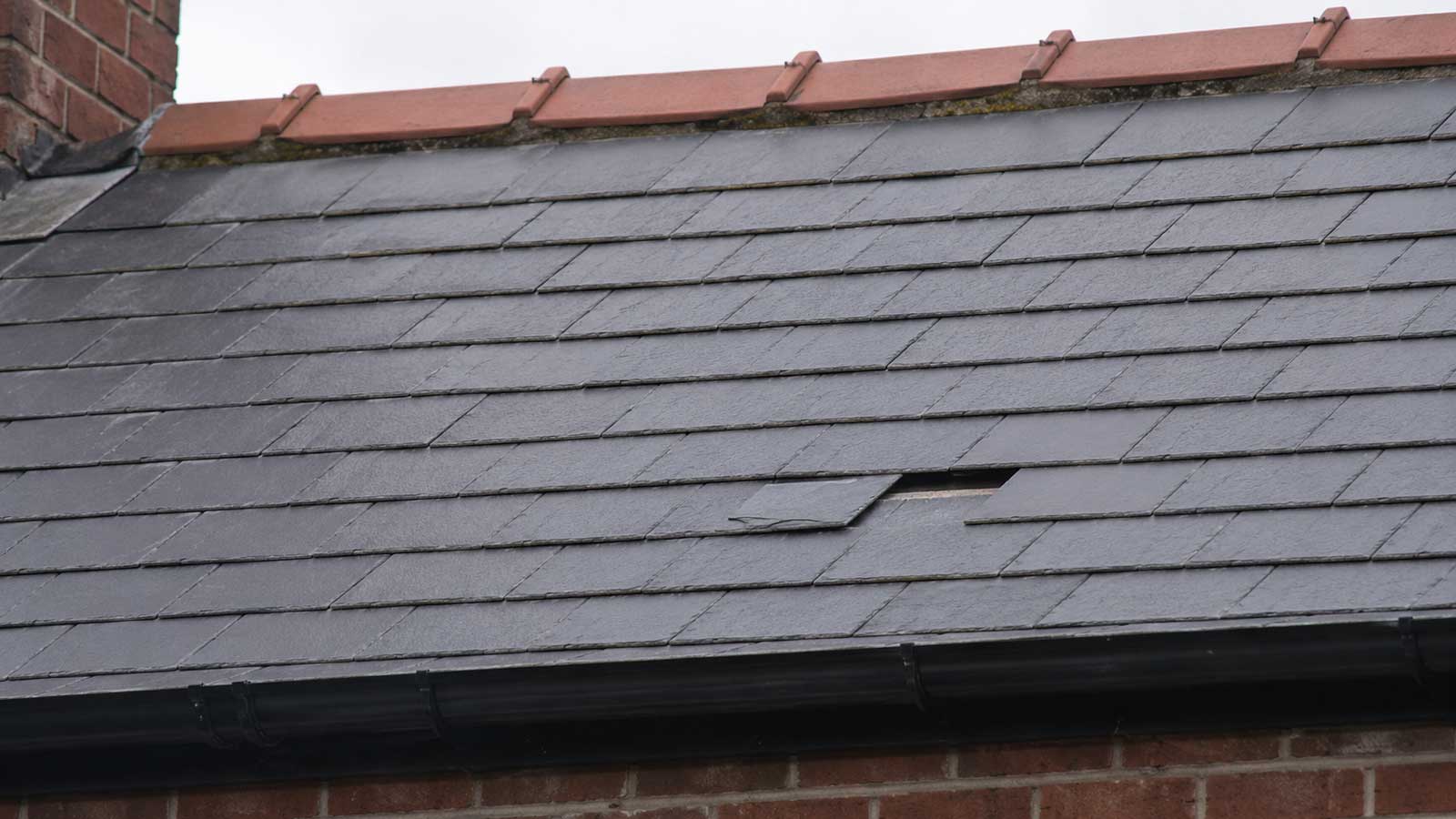 Roofing detail relevant to slipped slate repairs in stockport